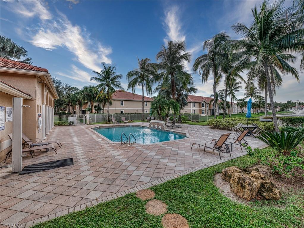 Community pool featuring a patio