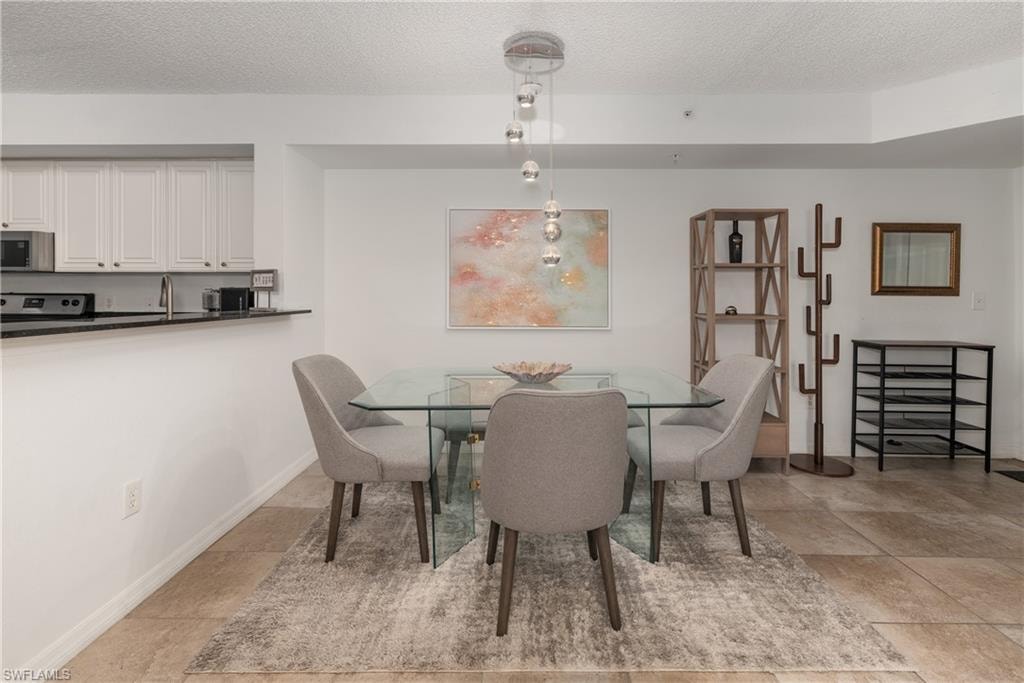 Dining room featuring a textured ceiling