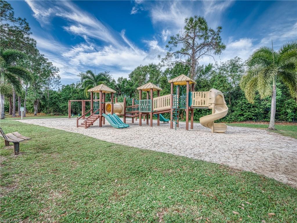 Community playground featuring a lawn