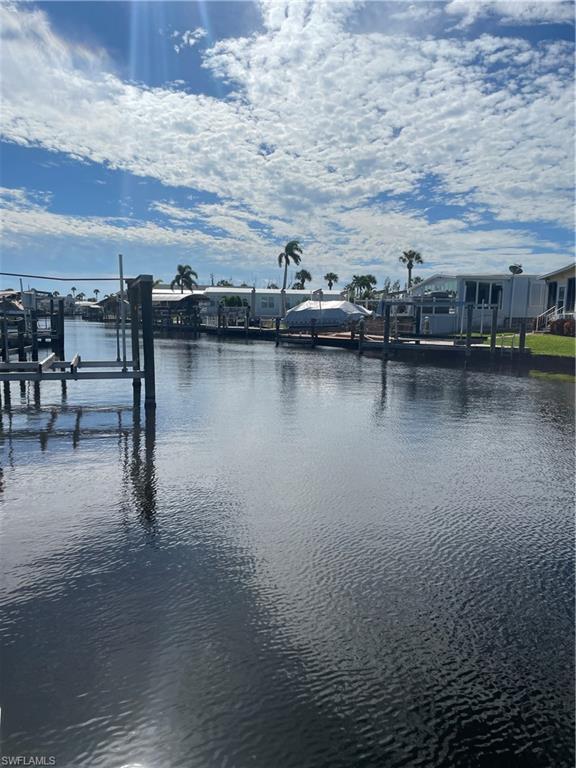 Dock with boat lift and a water view