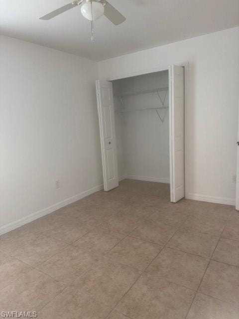 Unfurnished bedroom featuring a closet, a ceiling fan, and light tile patterned floors