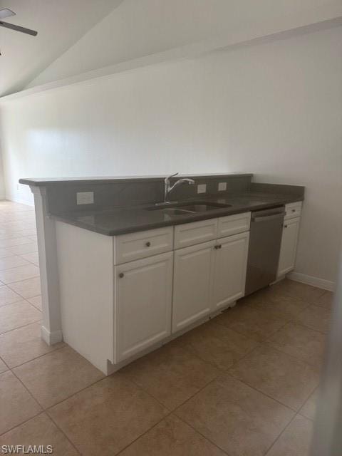 Kitchen with white cabinetry, light tile patterned floors, lofted ceiling, dishwashing machine, and ceiling fan