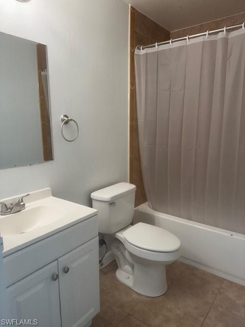 Bathroom with vanity, shower / bath combination with curtain, and tile patterned flooring