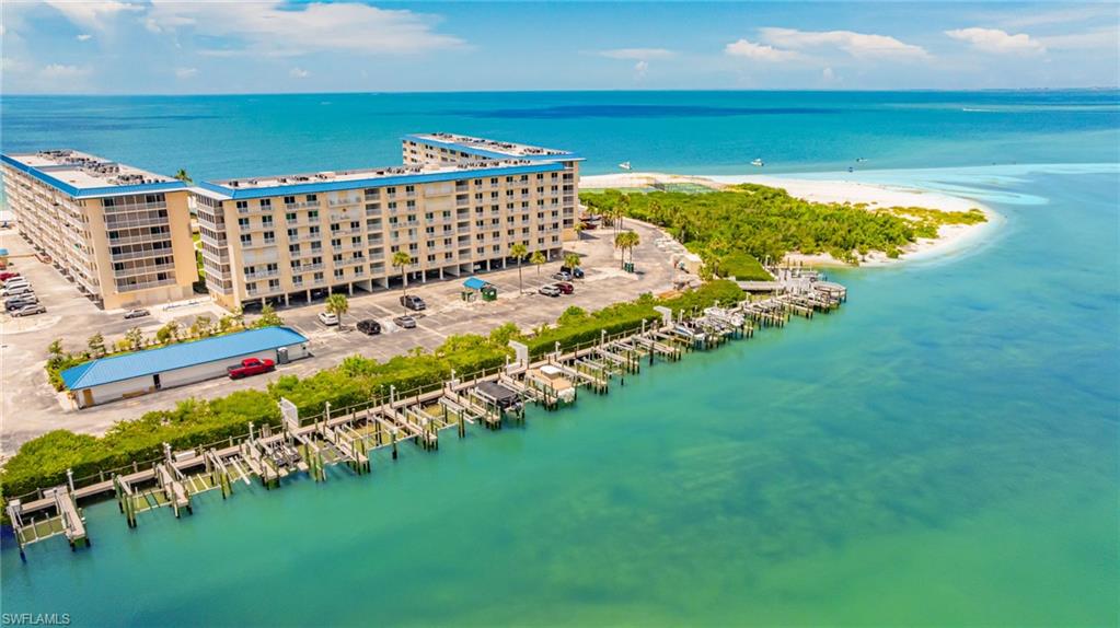 Bird's eye view of a nearby body of water and apartment complex / building