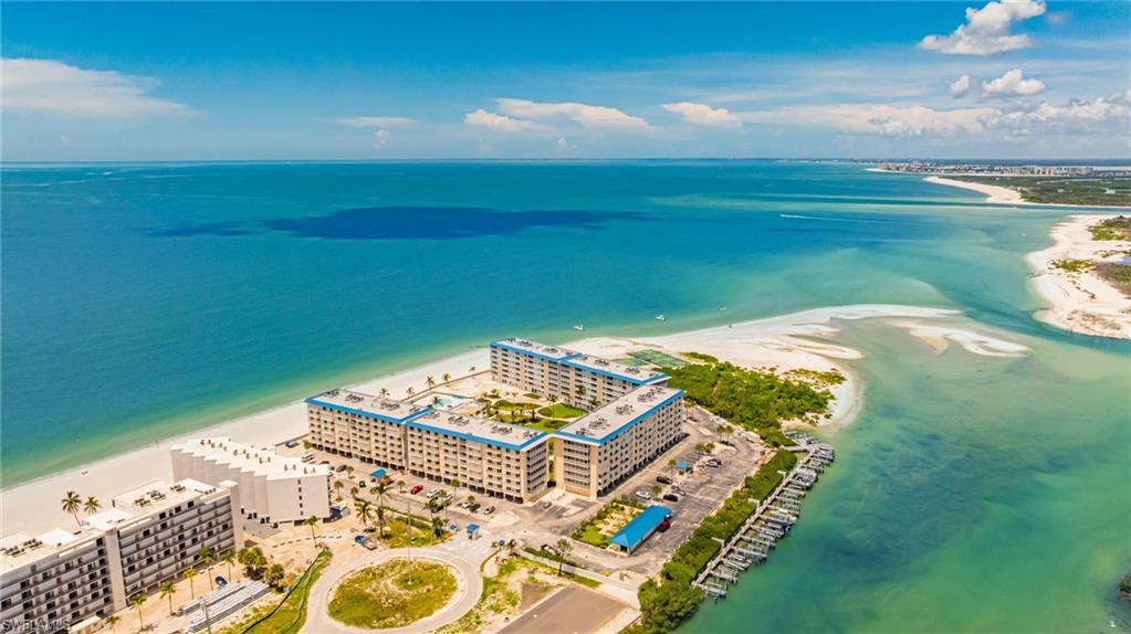Bird's eye view of expansive coastline and apartment complex