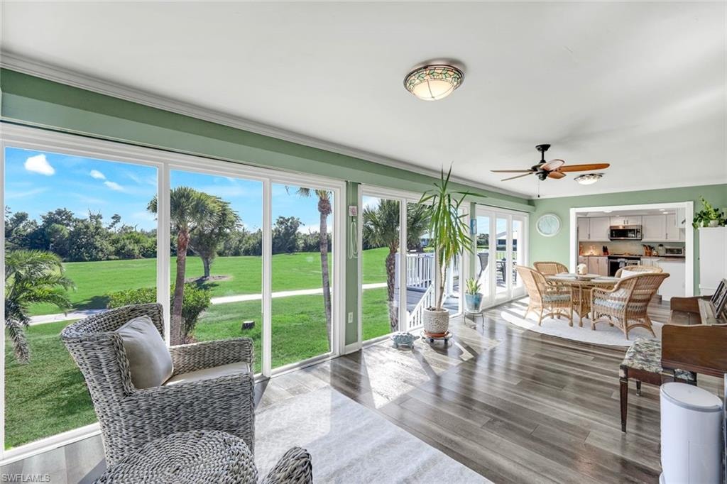 Sunroom with french doors and view of golf course