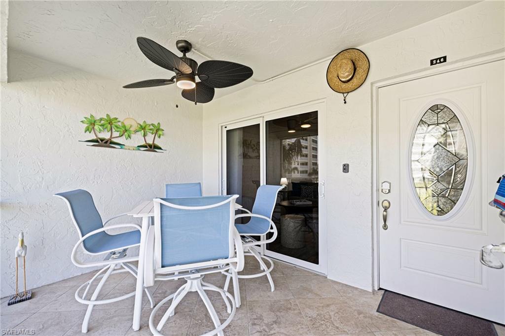 View of patio with a ceiling fan and outdoor dining space