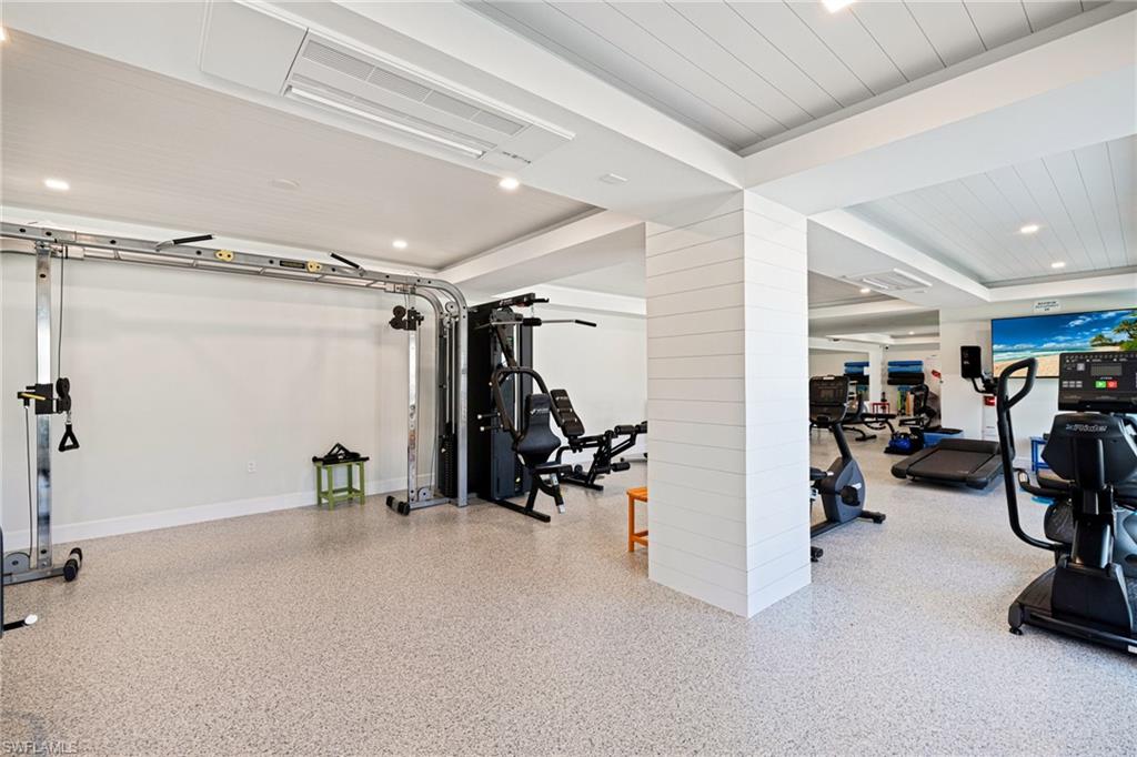 Workout area featuring recessed lighting