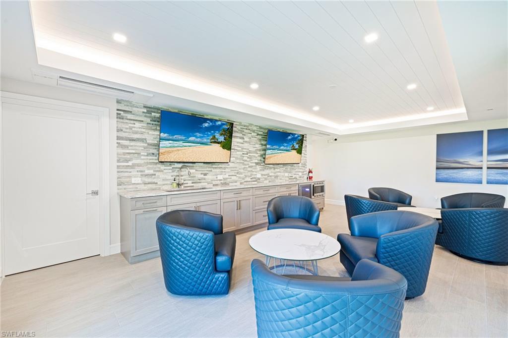 Community lobby with recessed lighting and wooden ceiling