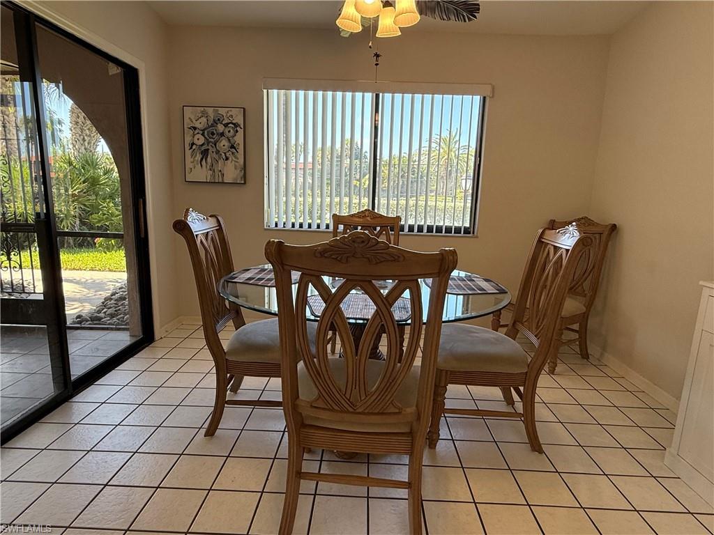 Dining area featuring light tile patterned flooring