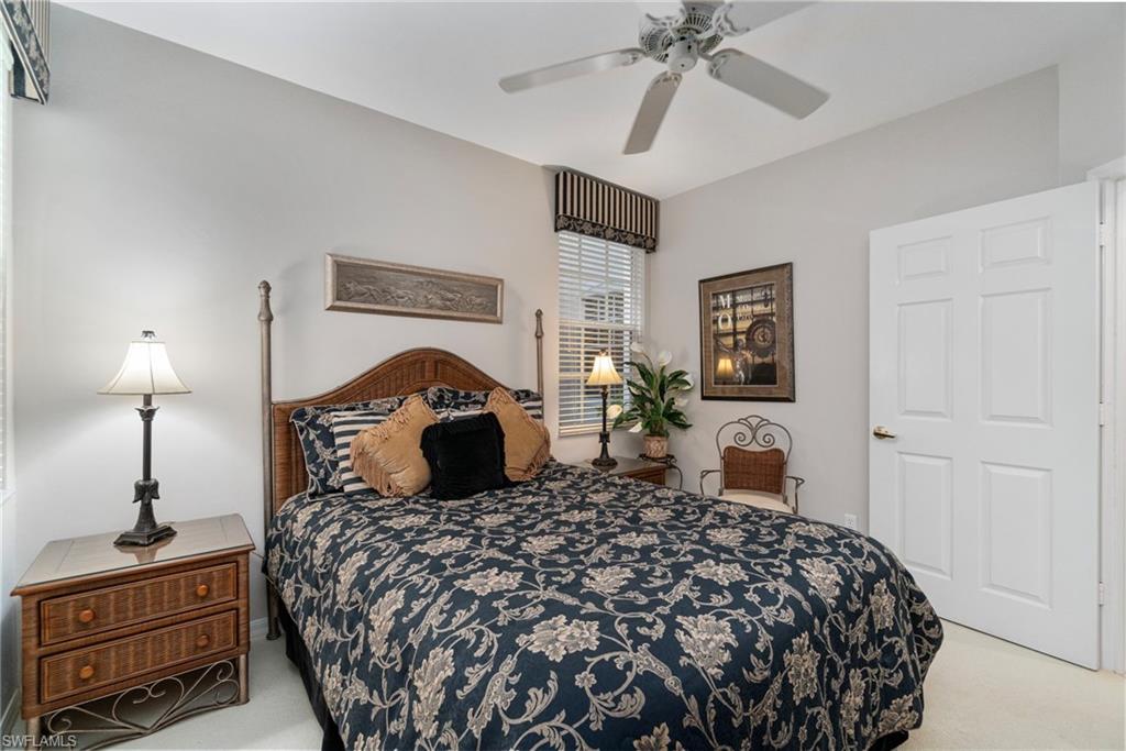 Bedroom with light carpet and ceiling fan