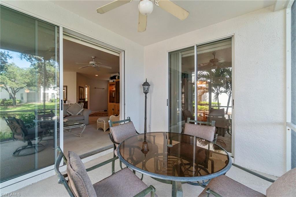 Sunroom featuring a textured wall and carpet floors