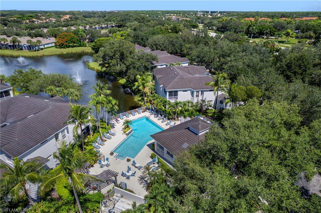 Bird's eye view of a pool area and a large body of water