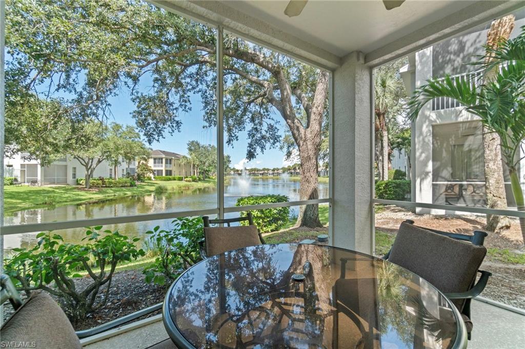 Sunroom with a water view