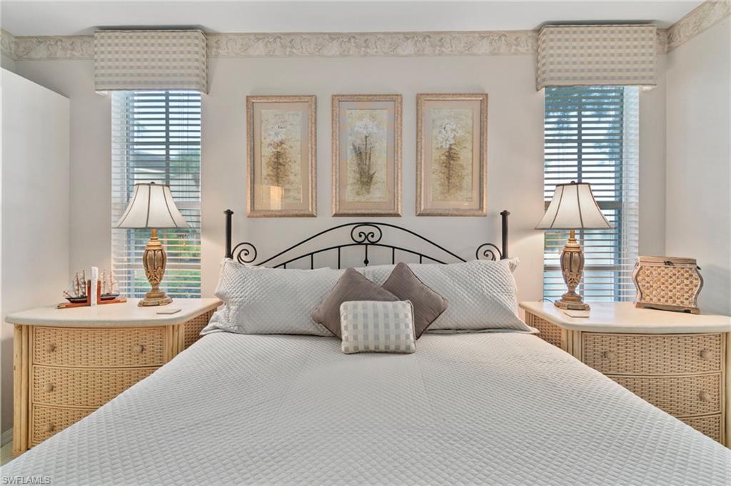 Bedroom featuring multiple windows
