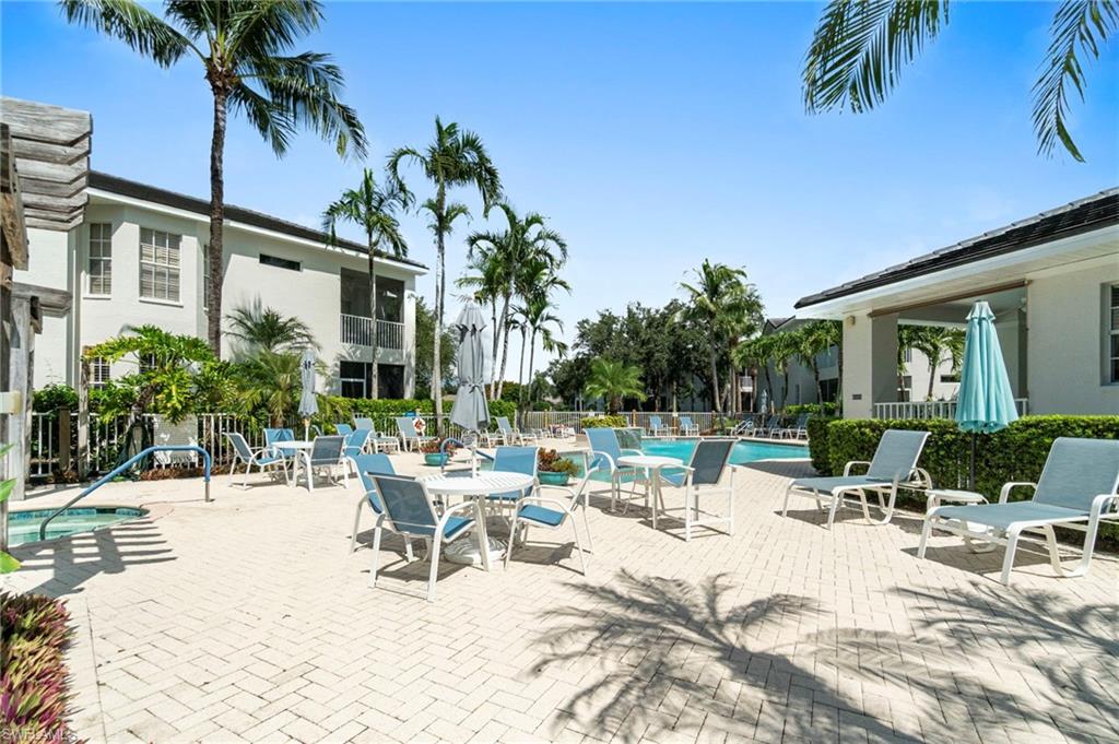 Community pool with a patio