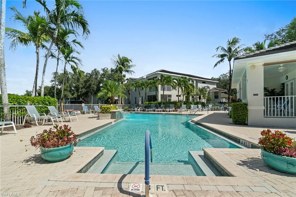Community pool with a patio
