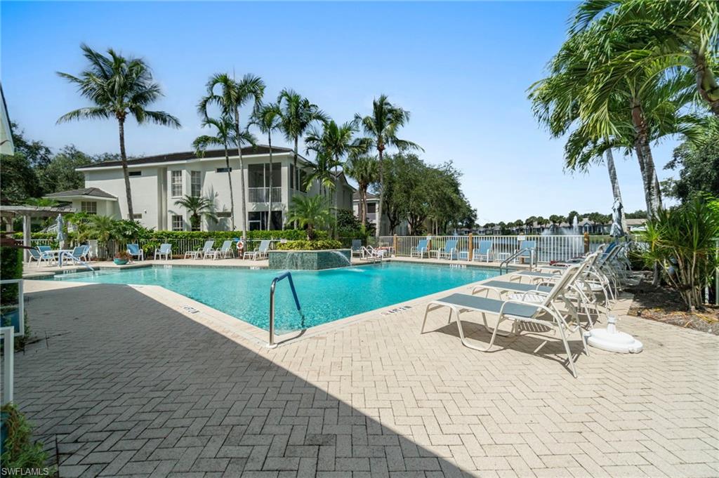 Community pool with a patio