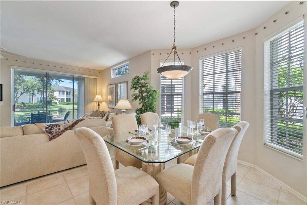 Dining area with plenty of natural light and light tile patterned floors