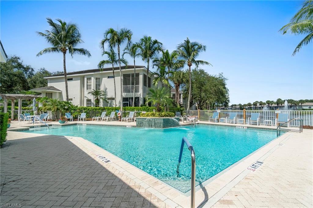 Community pool featuring a patio
