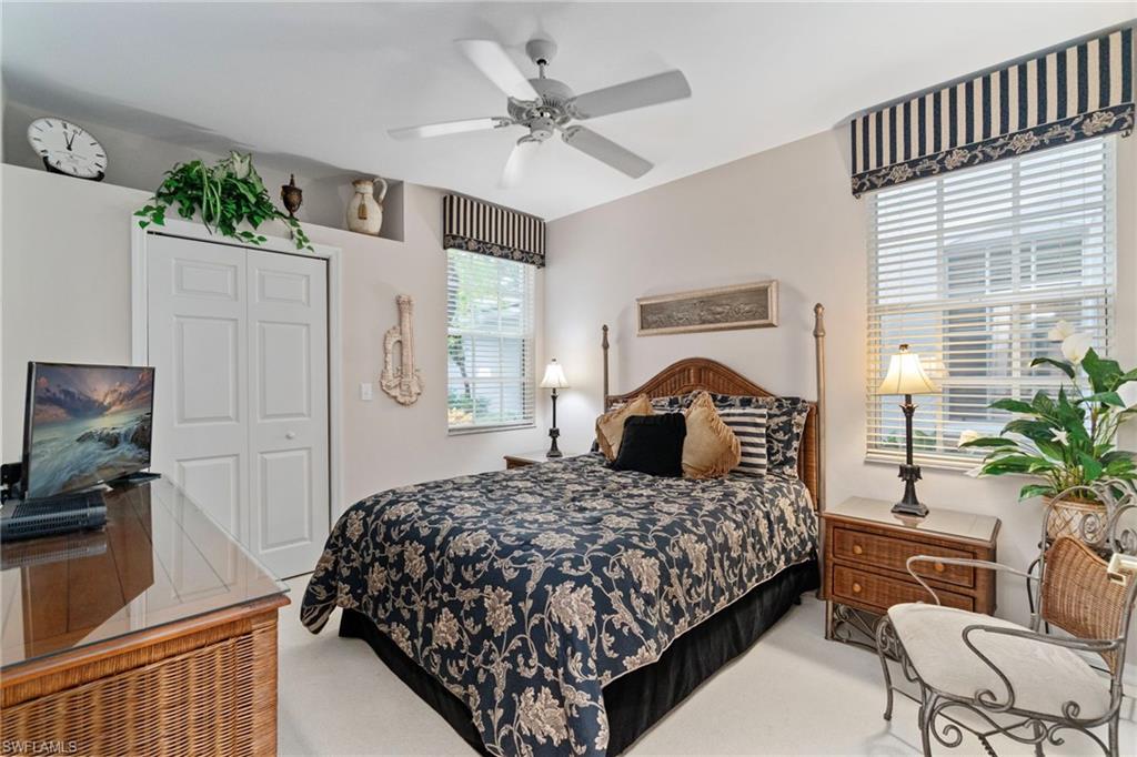 Bedroom with carpet flooring, a closet, and ceiling fan