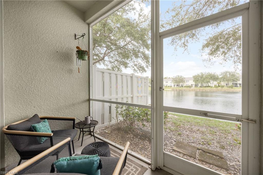 Sunroom with a water view and plenty of natural light