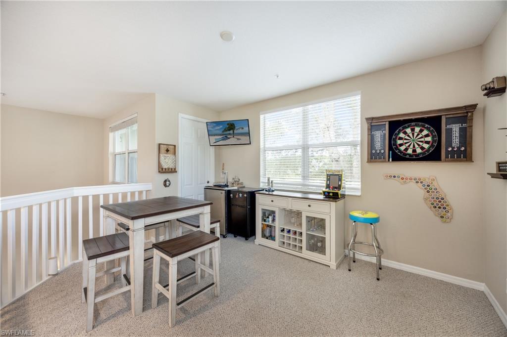 Dining space with light colored carpet