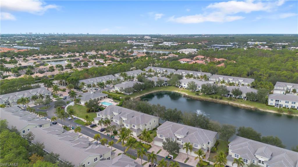View of property location featuring a large body of water and nearby suburban area