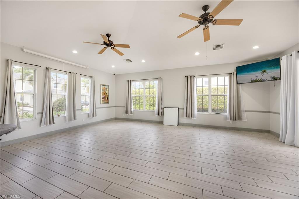 Unfurnished room with ceiling fan and recessed lighting