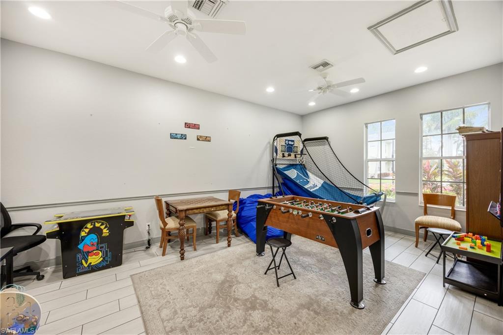 Playroom with recessed lighting and ceiling fan