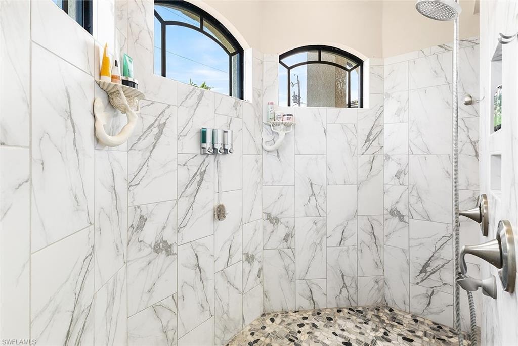 Owners bathroom featuring tiled shower