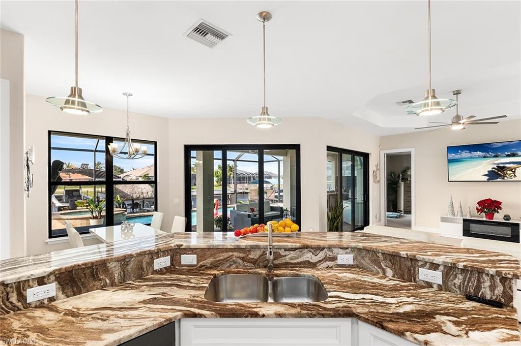 Kitchen with ceiling fan, and pendant lighting