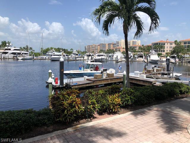 Dock with a water view and view of marina