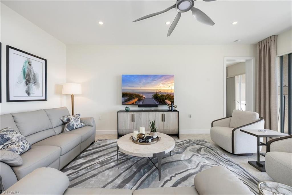 Living room featuring recessed lighting and ceiling fan