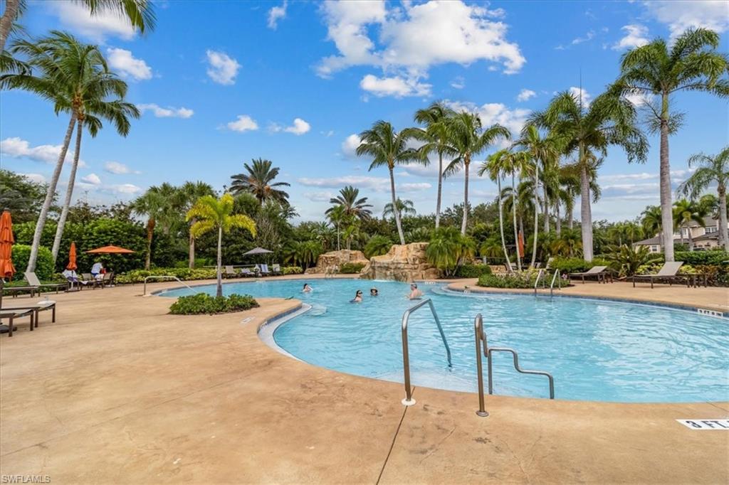 Community pool featuring a patio