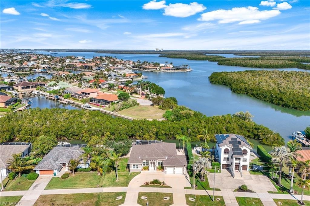 Aerial perspective of suburban area with a nearby body of water