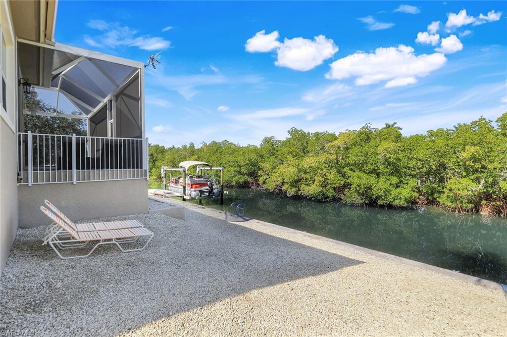 View of parking / parking lot with a dock