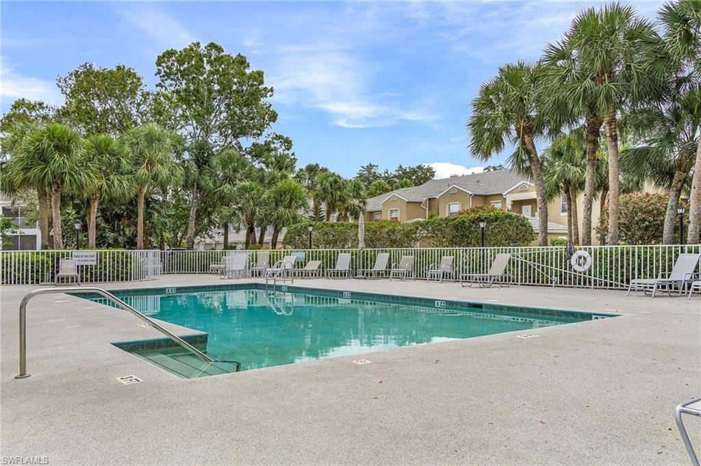 Community pool with a patio