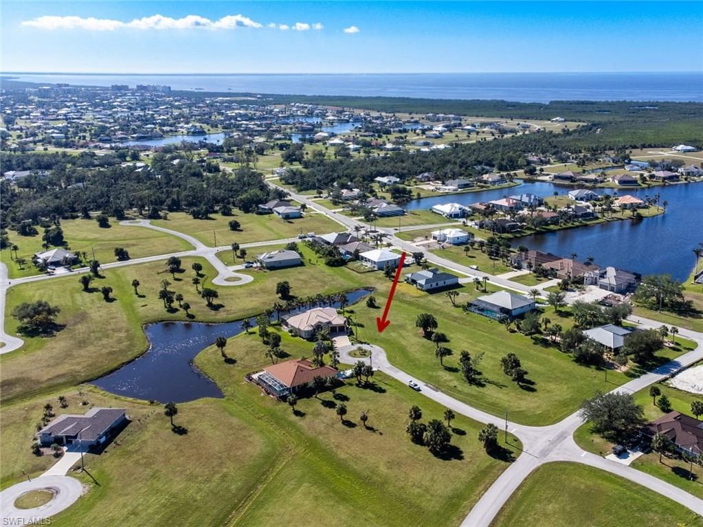 View of property location with a large body of water