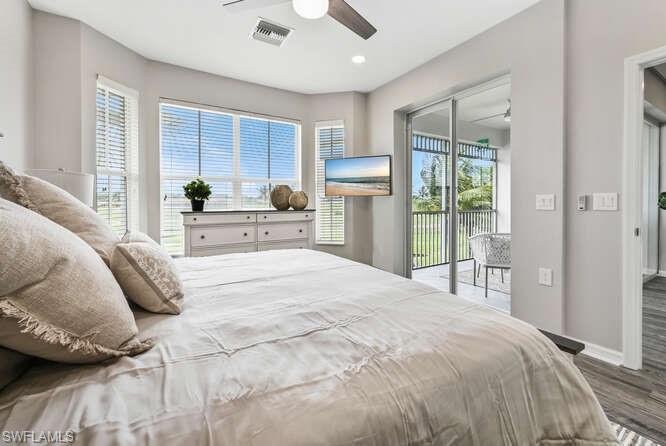 Bedroom with access to exterior, wood finished floors, ceiling fan, and recessed lighting