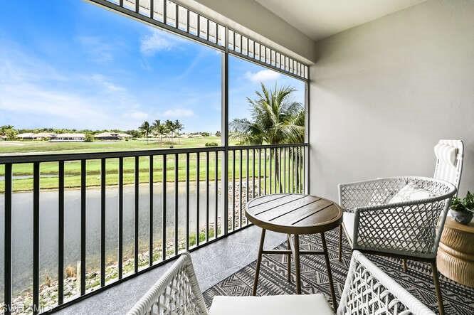 Balcony featuring view of golf course