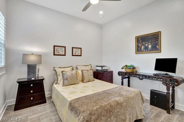 Original third bedroom featuring porcelain tiled floors,  ceiling fan, and recessed lighting