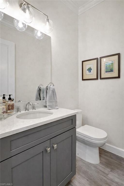 Hallway Half-Bathroom with vanity and quartz counter