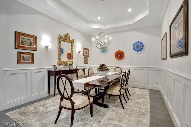 CURRENT dining/flex room with custom wainscoting walls.