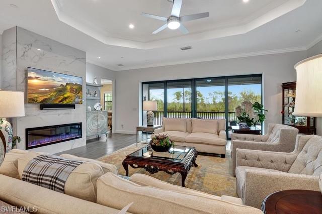 Overlooking expansive family room, fireplace, and lanai.