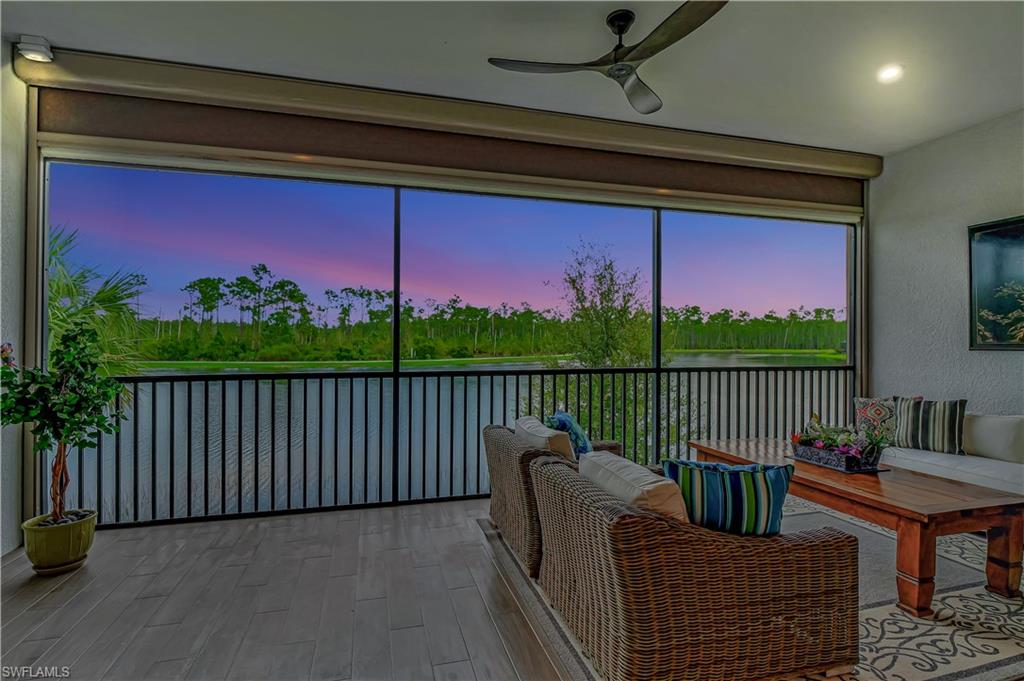 Awesome twilight views of sweeping lake and preserves as seen from the family room. Not shown remote power screens