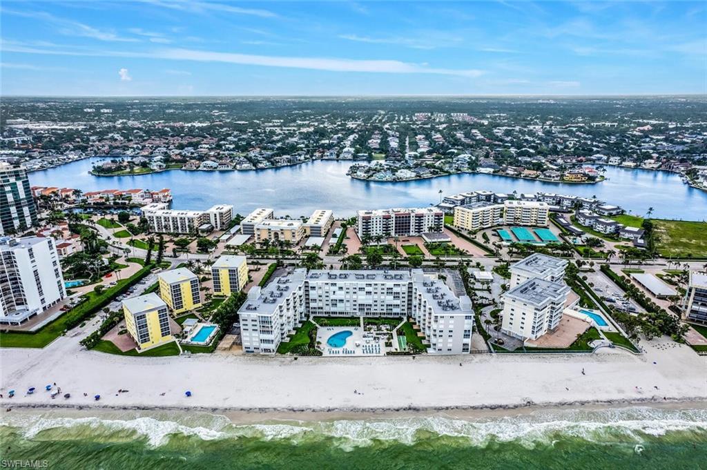 View of urban area featuring expansive beach