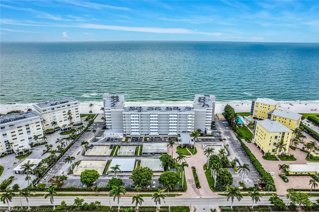 Bird's eye view of a nearby body of water and apartment complex