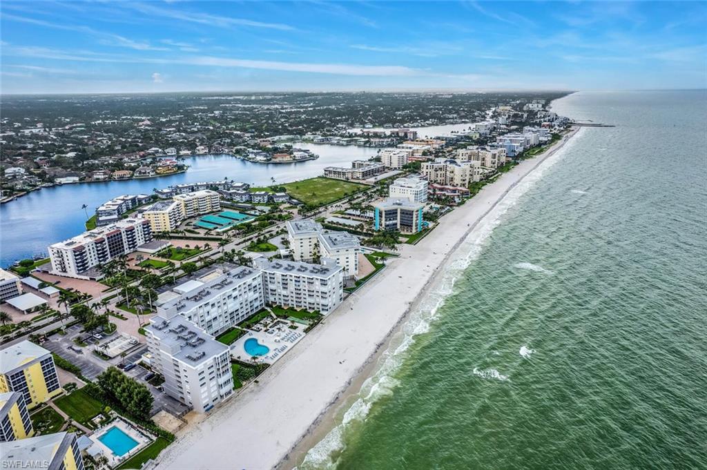 Drone / aerial view of waterfront with a beach