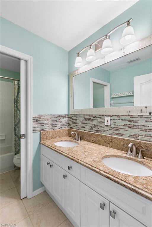 Your second full bathroom features a double vanity, shower / bathtub combination, decorative backsplash, granite countertop. This bathroom is located on the second level.
